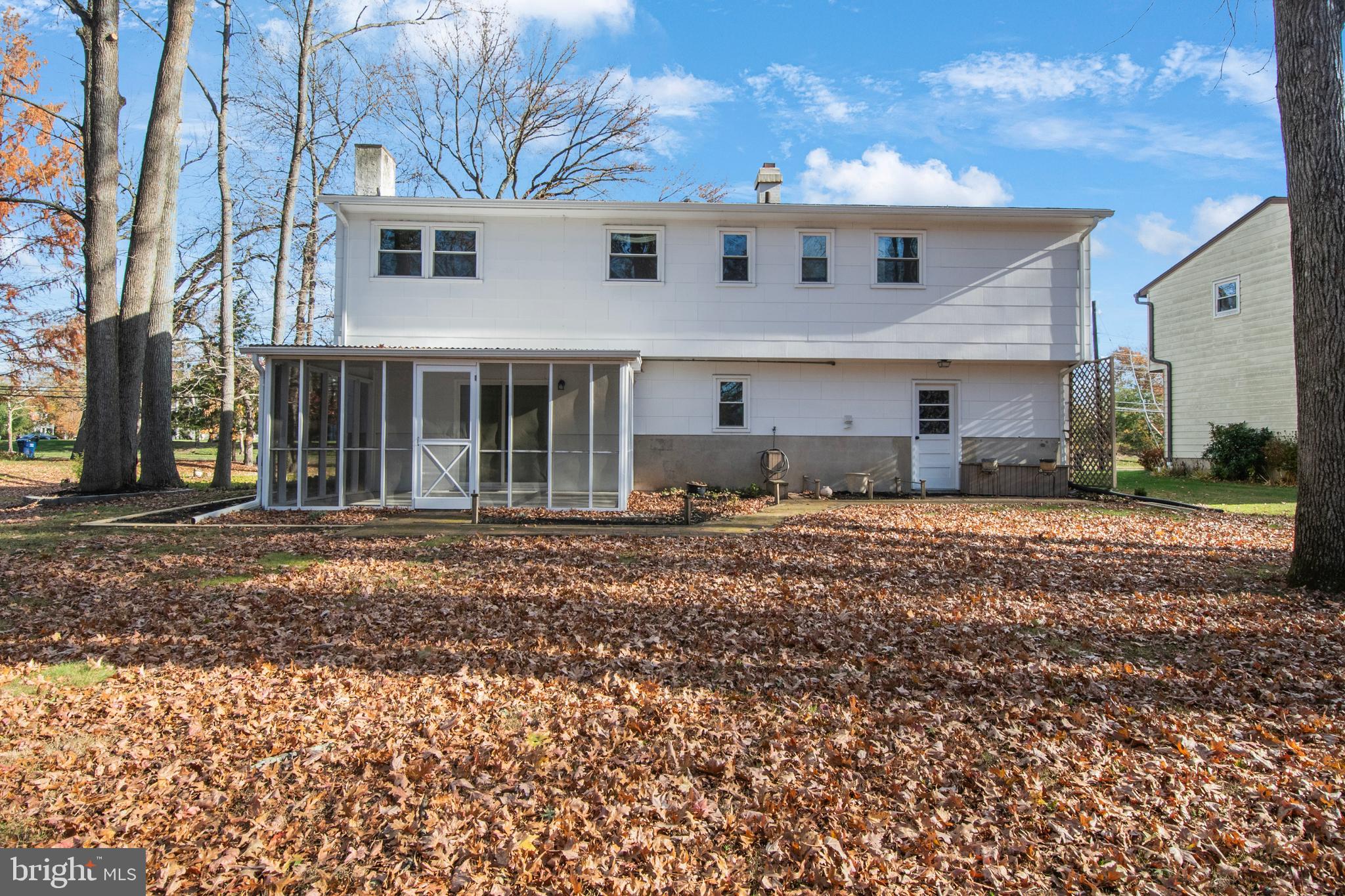 155 Franklin Corner Road Lawrence Township, NJ 08648 - Photo 27 of 29 a front view of a house with a yard and a garage