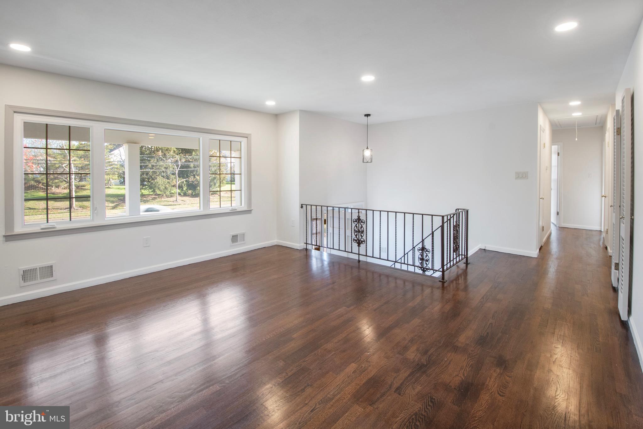 155 Franklin Corner Road Lawrence Township, NJ 08648 - Photo 3 of 29 an empty room with wooden floor and windows
