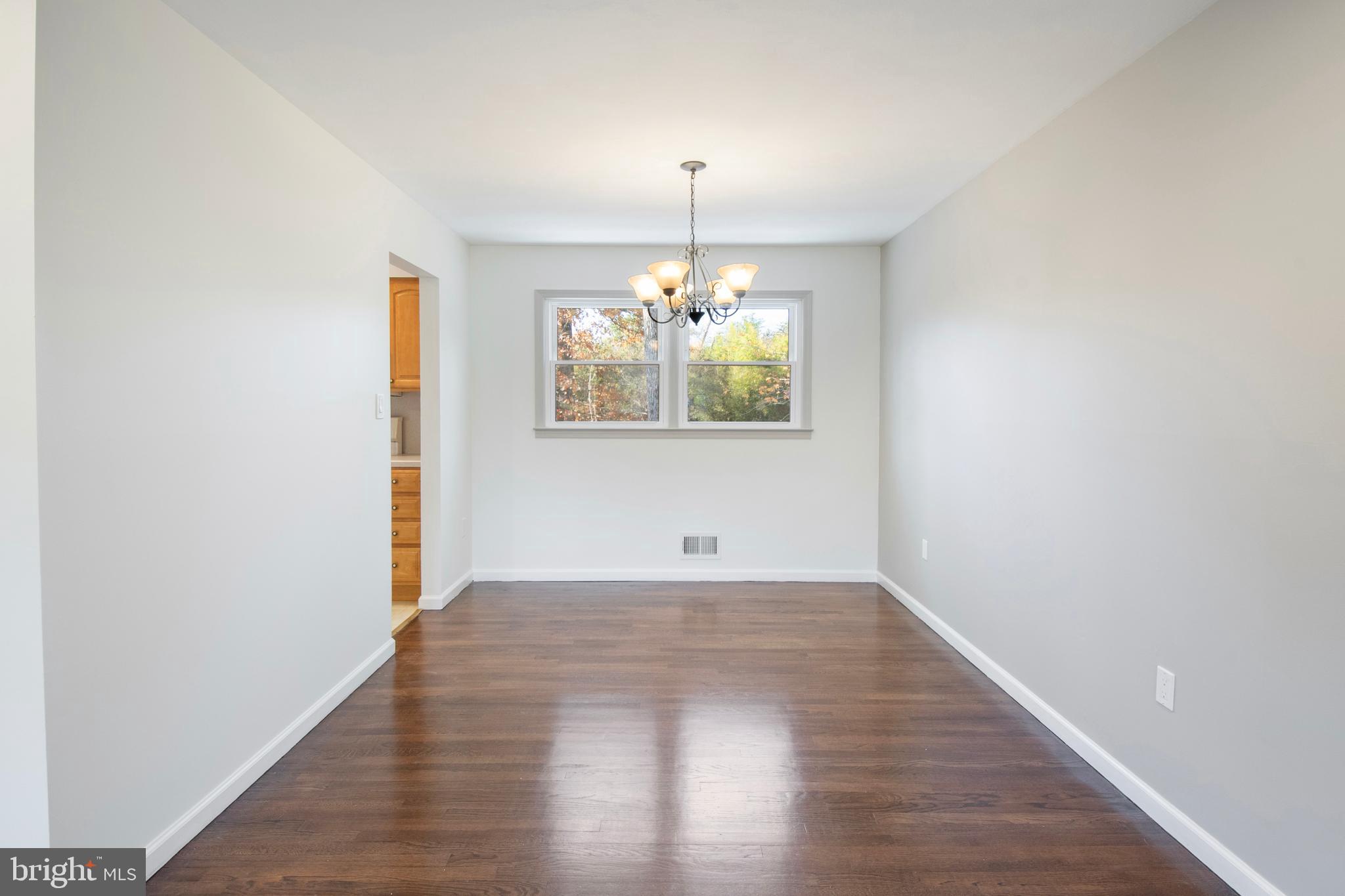 155 Franklin Corner Road Lawrence Township, NJ 08648 - Photo 6 of 29 a view of an empty room with wooden floor and a window