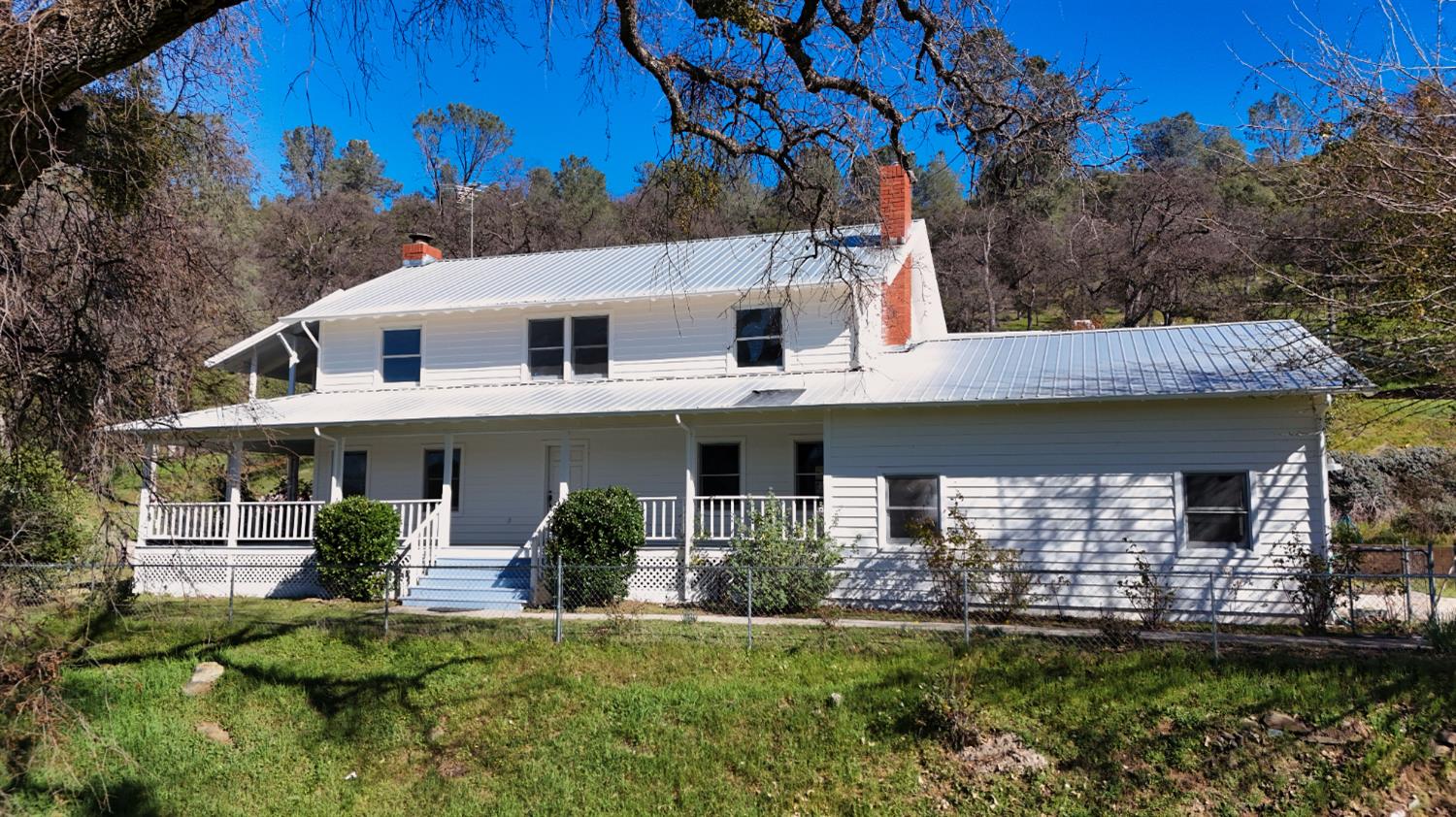 1933 Appaloosa Road Angels Camp, CA 95222 - Photo 1 of 75 a front view of a house with a garden