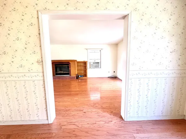a kitchen with granite countertop a refrigerator and a sink
