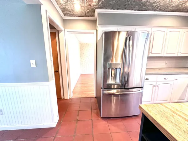 a kitchen with a window a sink and a counter
