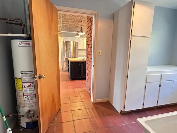 a bathroom with a sink toilet and a mirror