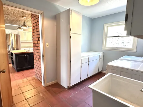 a view of an entryway with wooden floor and stairs