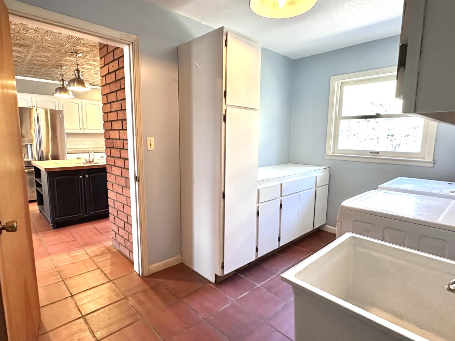 1933 Appaloosa Road Angels Camp, CA 95222 - Photo 22 of 75 a view of a kitchen with kitchen island granite countertop a refrigerator and a stove