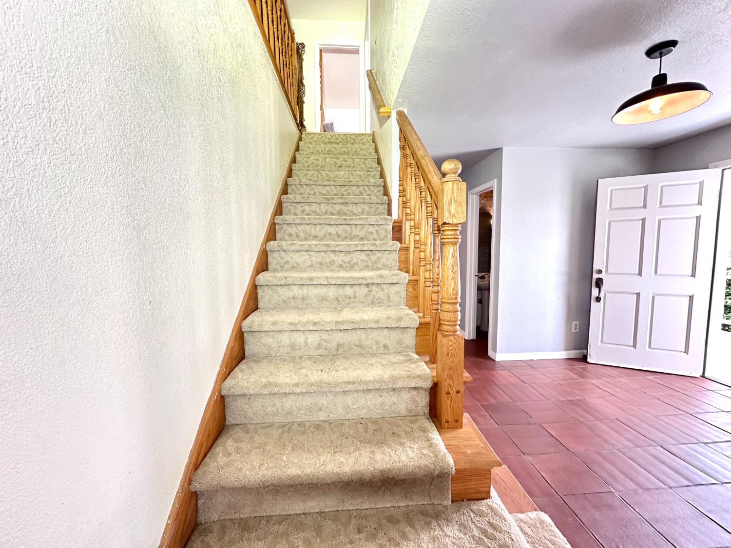 1933 Appaloosa Road Angels Camp, CA 95222 - Photo 26 of 75 a view of an entryway with wooden floor and stairs