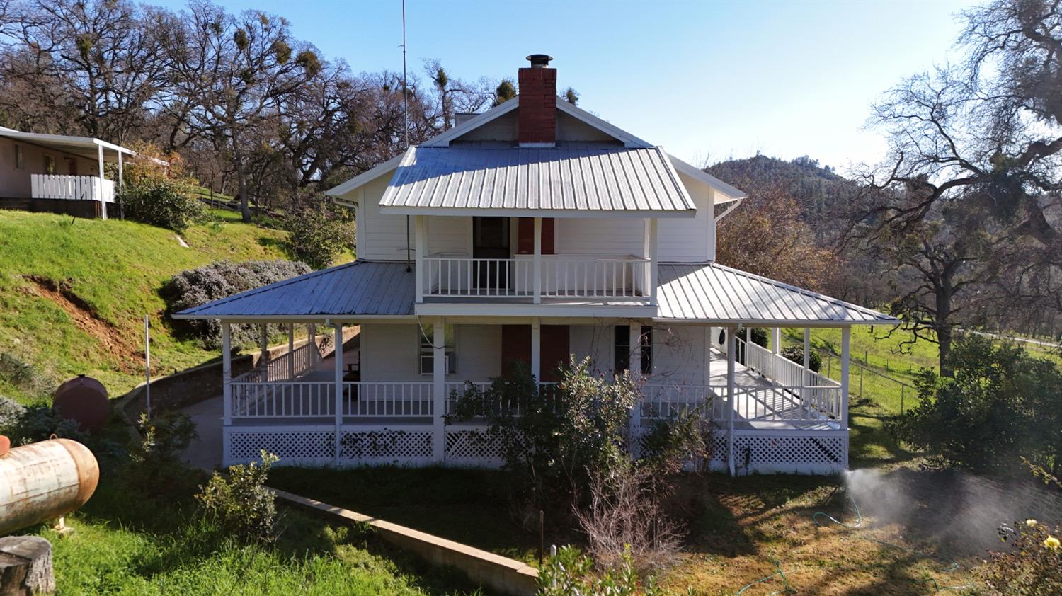 1933 Appaloosa Road Angels Camp, CA 95222 - Photo 71 of 75 a front view of a house with a garden and swimming pool