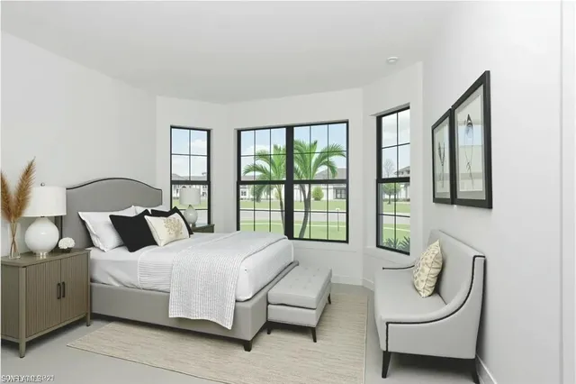 a bedroom with bed and glass window