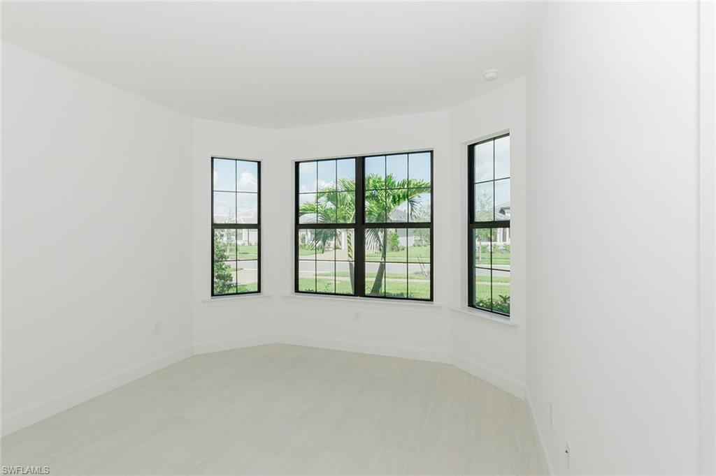 1954 Fresno Avenue Naples, FL 34120 - Photo 14 of 40 an empty room with windows