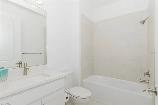 a bathroom with a sink a toilet and a bathtub