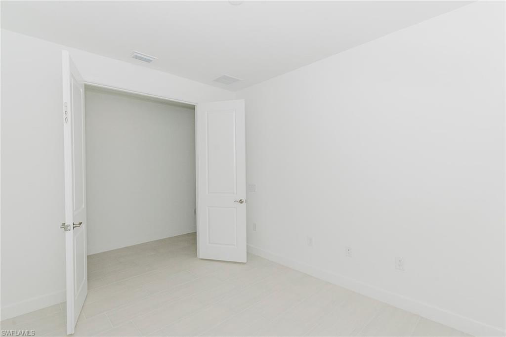 1954 Fresno Avenue Naples, FL 34120 - Photo 20 of 40 a view of an empty room