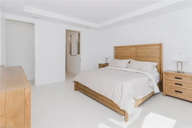 a bedroom with a bed and dresser