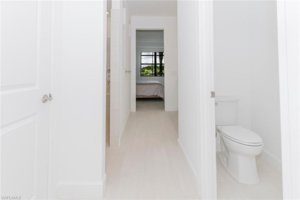 1954 Fresno Avenue Naples, FL 34120 - Photo 33 of 40 a bathroom with a toilet
