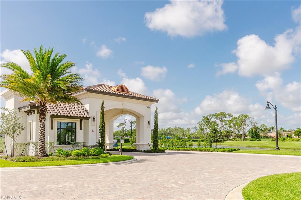 1954 Fresno Avenue Naples, FL 34120 - Photo 4 of 40 a front view of a house with garden
