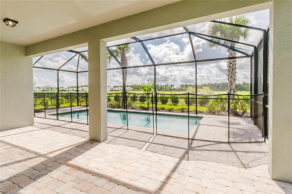 1954 Fresno Avenue Naples, FL 34120 - Photo 10 of 40 a room with a large window and a bed
