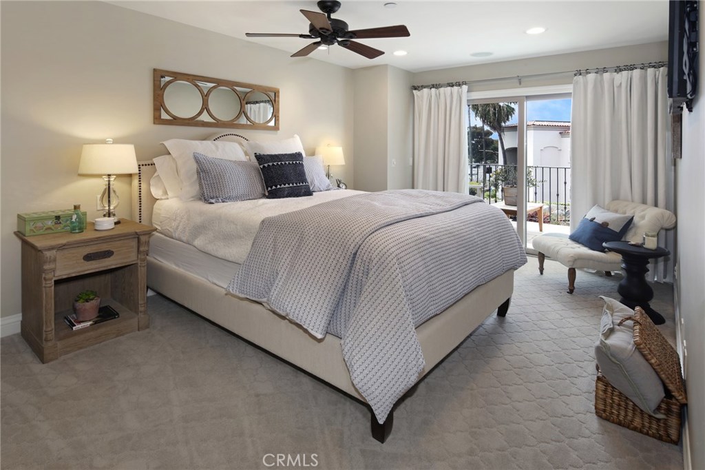 23711 Colima Bay Dana Point, CA 92629 - Photo 15 of 45 a bedroom with a bed and a chandelier