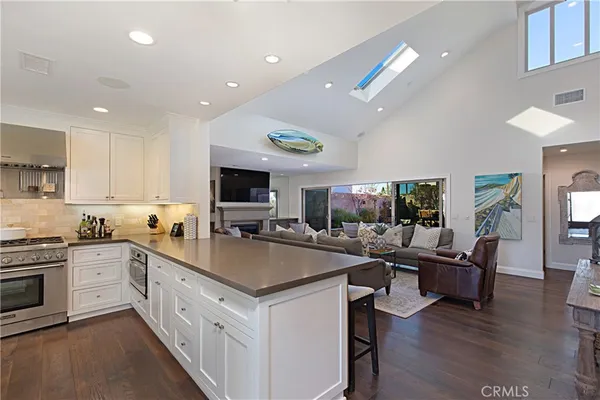a kitchen with stainless steel appliances granite countertop a stove and a sink