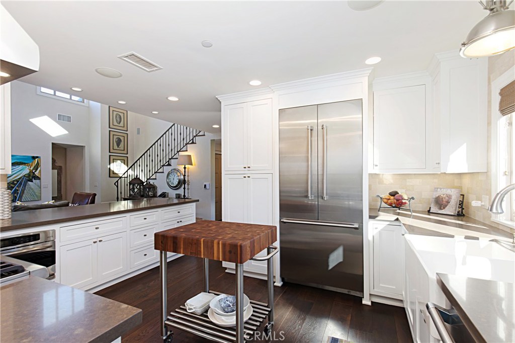 23711 Colima Bay Dana Point, CA 92629 - Photo 5 of 45 a kitchen with a sink stainless steel appliances and cabinets