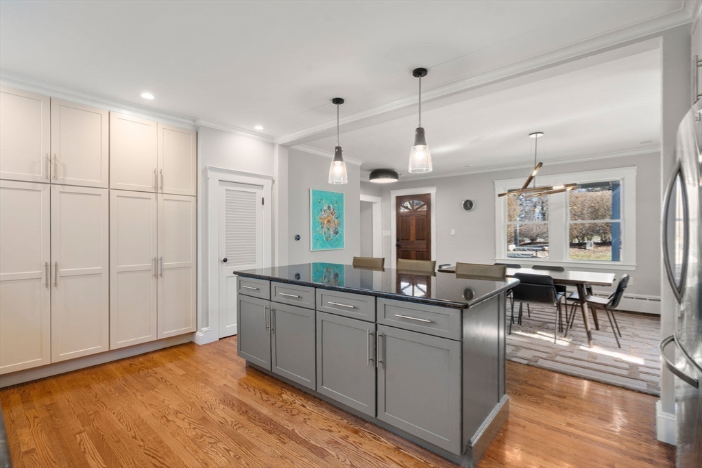 89 Prospect Street Newton, MA 02465 - Photo 14 of 31 a kitchen with stainless steel appliances granite countertop a sink and a refrigerator
