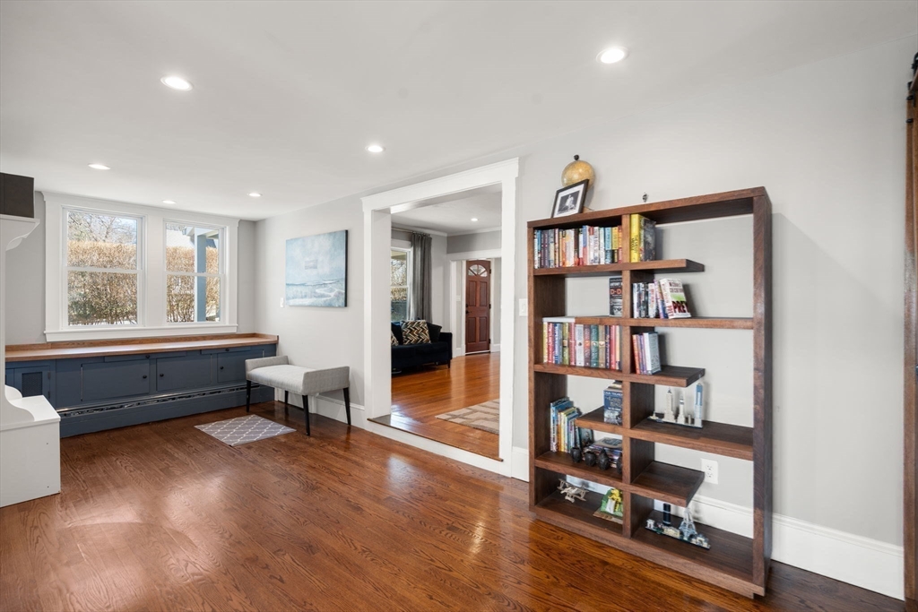 89 Prospect Street Newton, MA 02465 - Photo 18 of 31 a living room with furniture and a book shelf