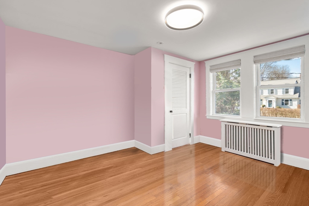 89 Prospect Street Newton, MA 02465 - Photo 26 of 31 an empty room with wooden floor and windows