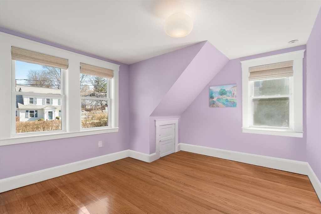 89 Prospect Street Newton, MA 02465 - Photo 27 of 31 a view of an empty room with wooden floor and a window