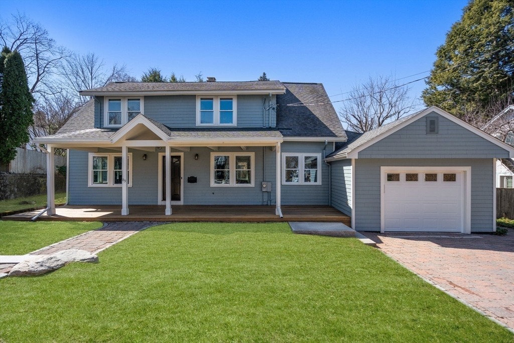 89 Prospect Street Newton, MA 02465 - Photo 31 of 31 a front view of a house with a garden and yard