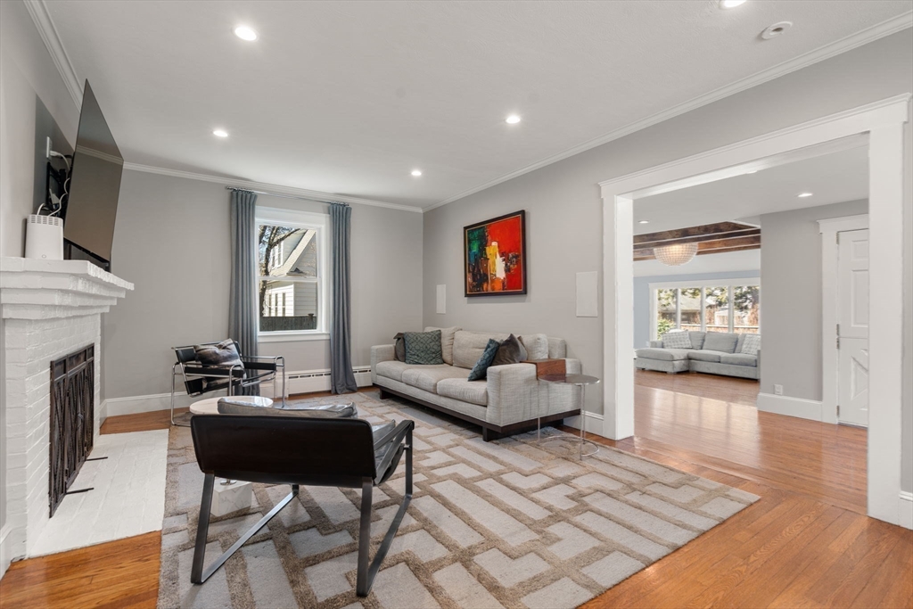 89 Prospect Street Newton, MA 02465 - Photo 4 of 31 a living room with furniture and a fireplace