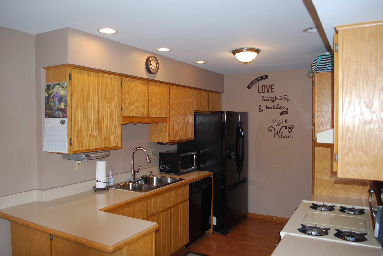 306 Circlegate Road, Unit 306 New Lenox, IL 60451 - Photo 3 of 15 a kitchen with stainless steel appliances a sink stove and refrigerator