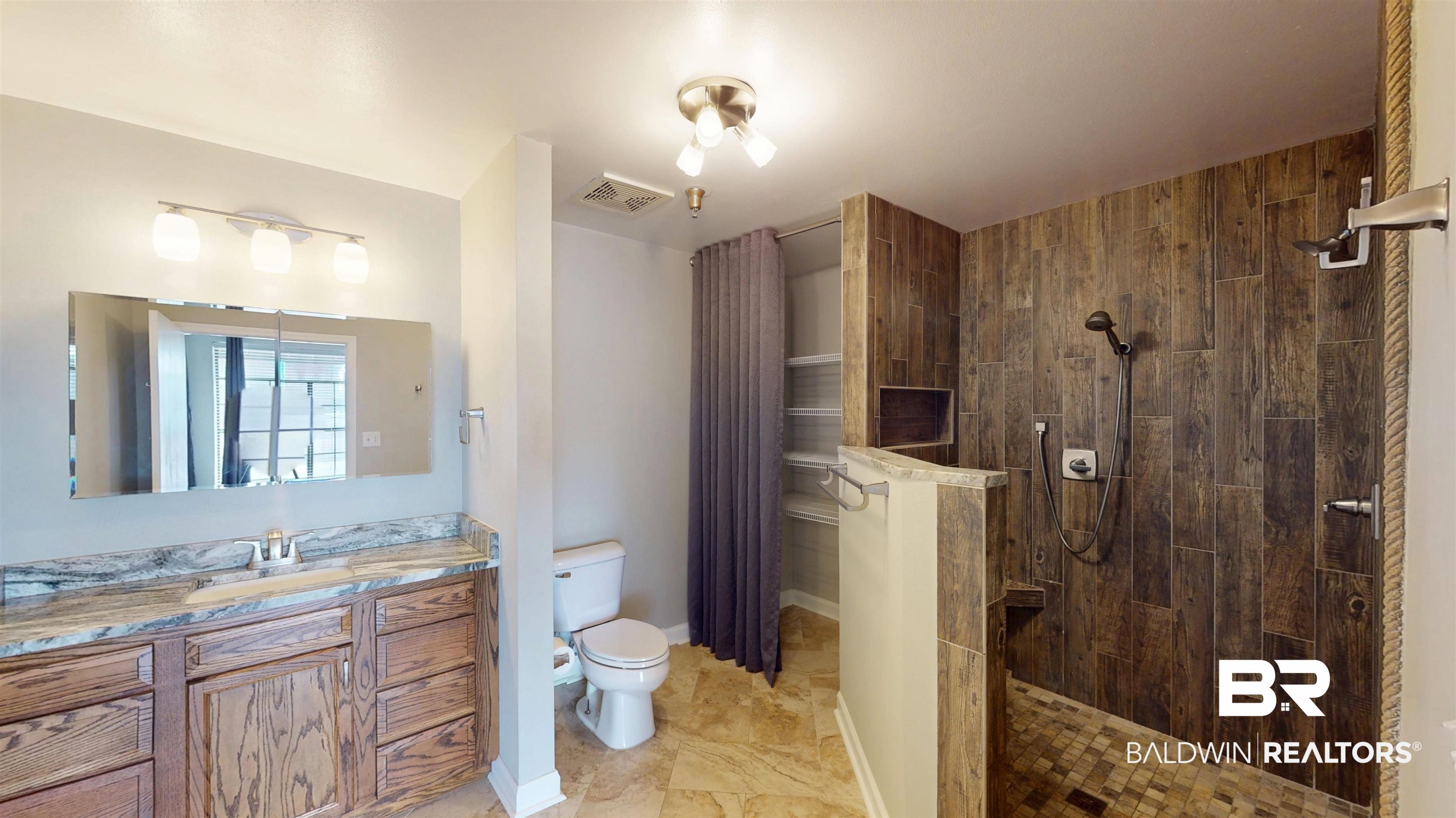 308 St Louis Street, Unit 101 Mobile, AL 36602 - Photo 6 of 30 Full bath featuring walk in shower and vanity