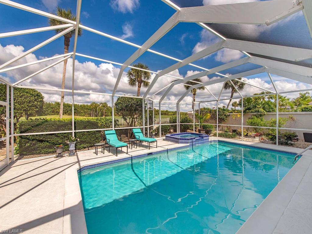 203 Via Napoli Naples, FL 34105 - Photo 13 of 13 a view of a backyard with sitting area
