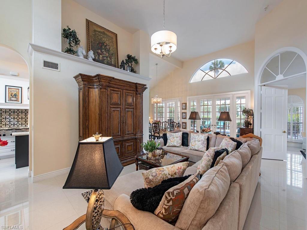 203 Via Napoli Naples, FL 34105 - Photo 5 of 13 a living room with furniture and a large window