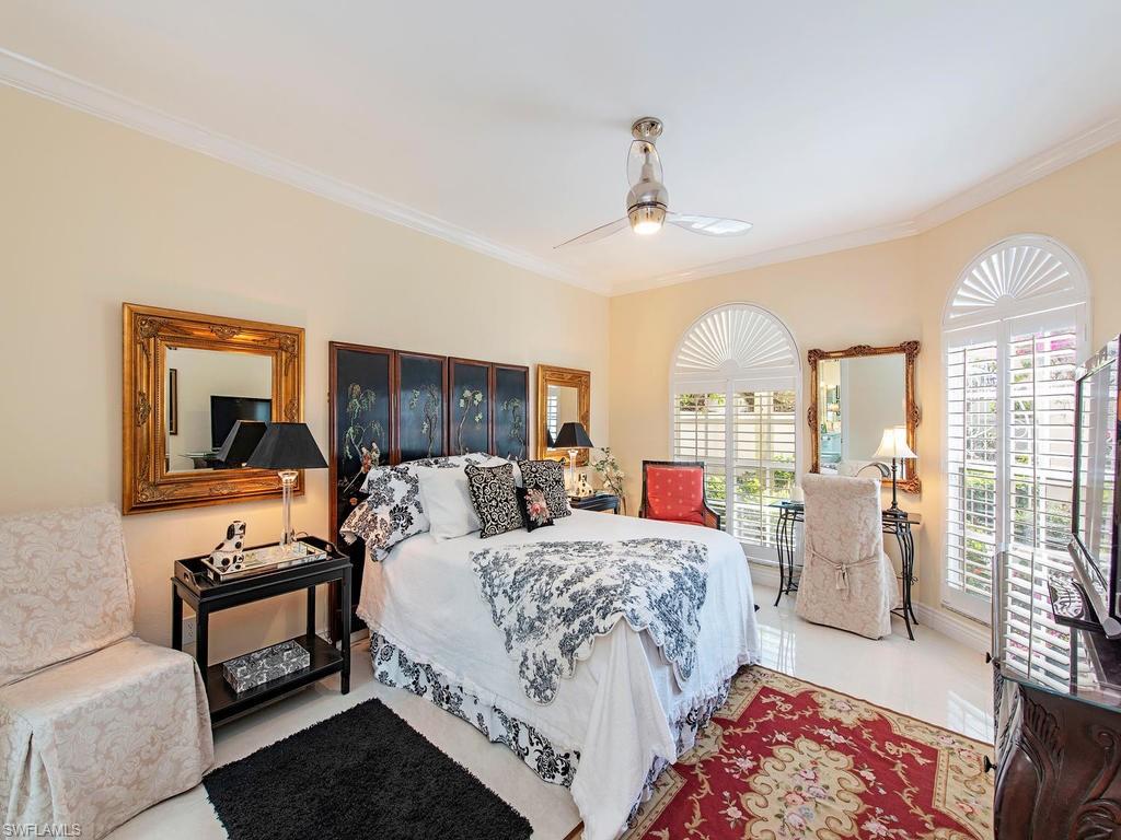 203 Via Napoli Naples, FL 34105 - Photo 8 of 13 a living room with furniture and a large window