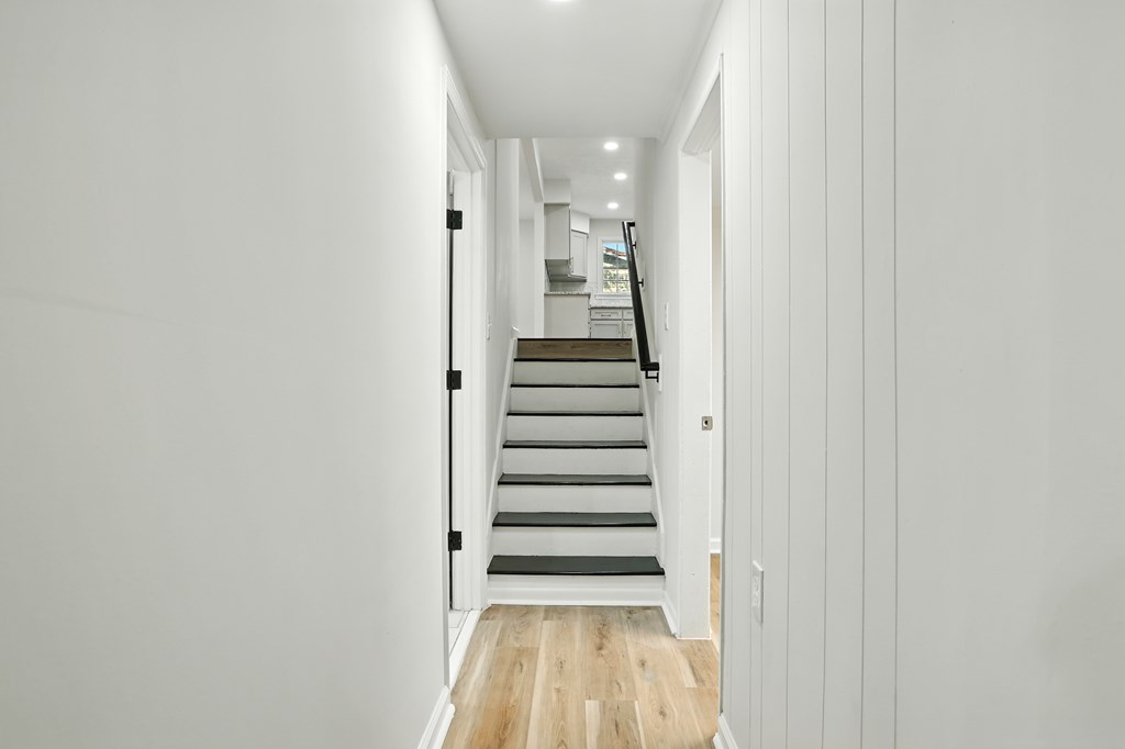 4627 Wimbish Court Columbus, GA 31909 - Photo 17 of 33 a view of a hallway with stairs and wooden floor