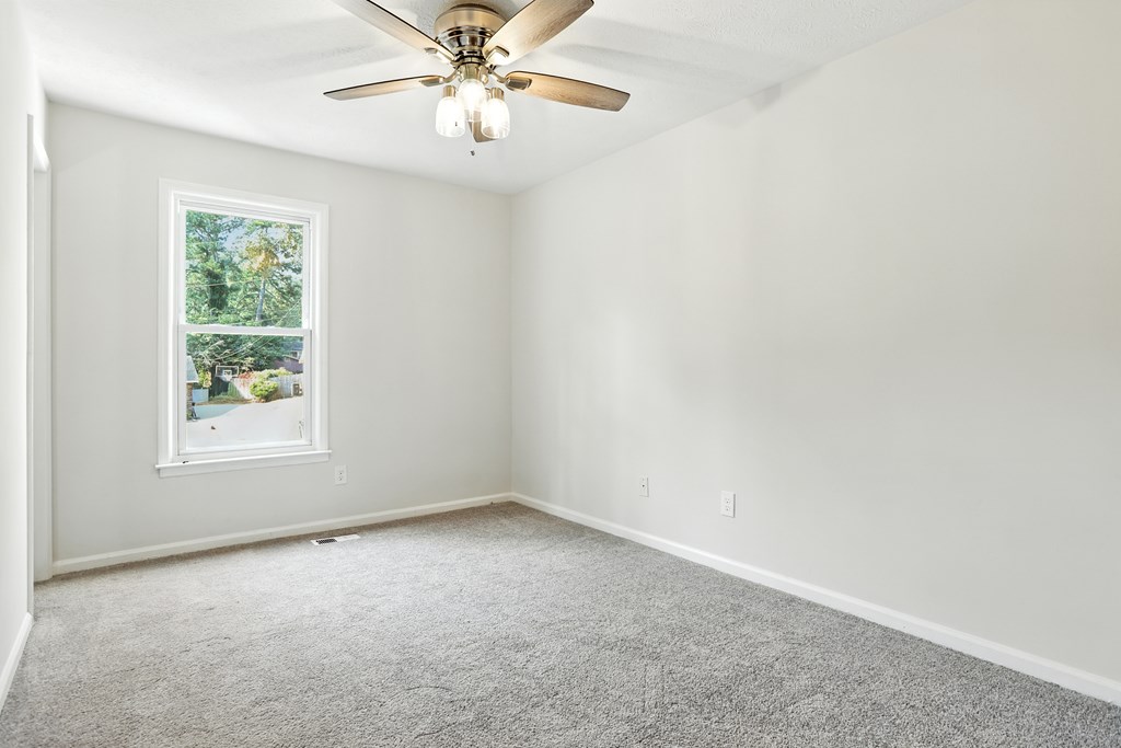 4627 Wimbish Court Columbus, GA 31909 - Photo 18 of 33 an empty room with a window and a fan