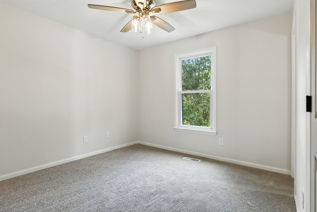 4627 Wimbish Court Columbus, GA 31909 - Photo 20 of 33 an empty room with a window and a fan