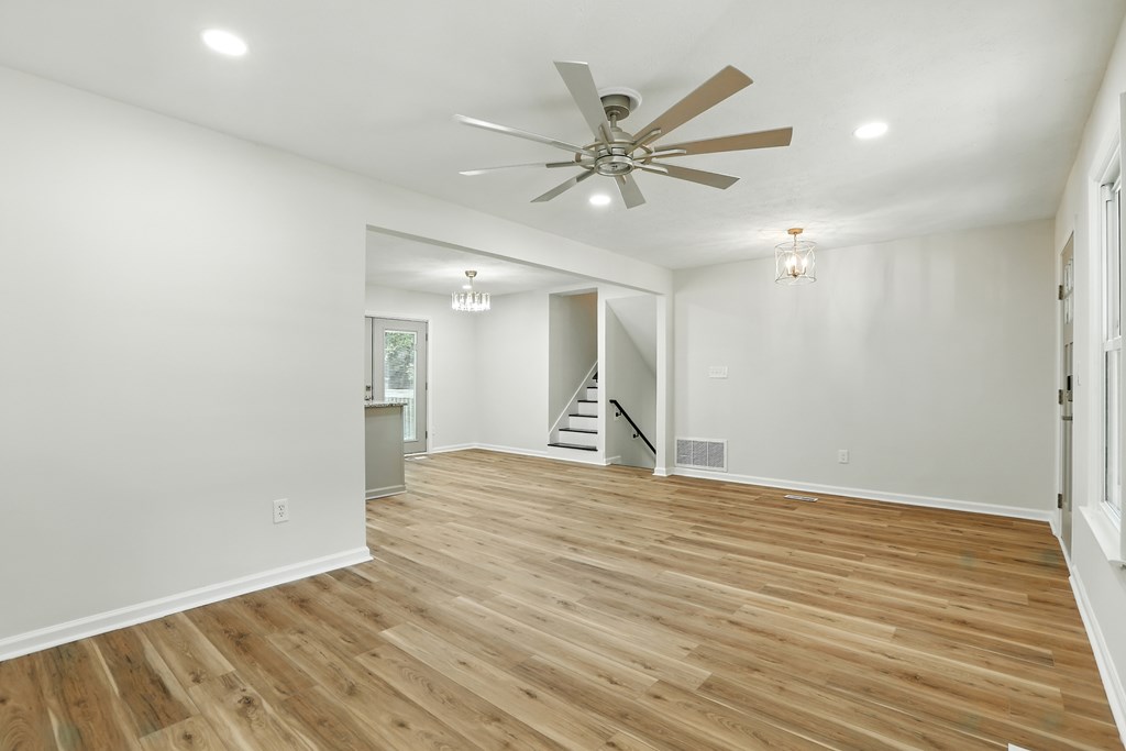 4627 Wimbish Court Columbus, GA 31909 - Photo 4 of 33 a view of an empty room with wooden floor and a ceiling fan