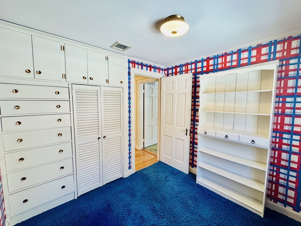 45 Beverly Road Brookline, MA 02467 - Photo 22 of 42 a view of an empty room with cabinet and stairs