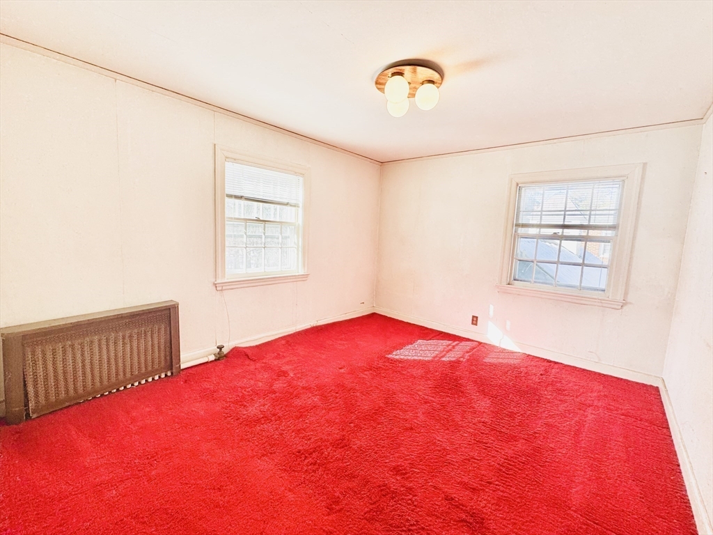 45 Beverly Road Brookline, MA 02467 - Photo 23 of 42 a view of a bedroom with a bed and a window