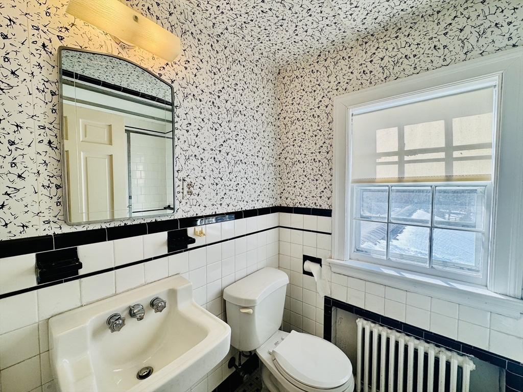 45 Beverly Road Brookline, MA 02467 - Photo 25 of 42 a bathroom with a sink and a toilet