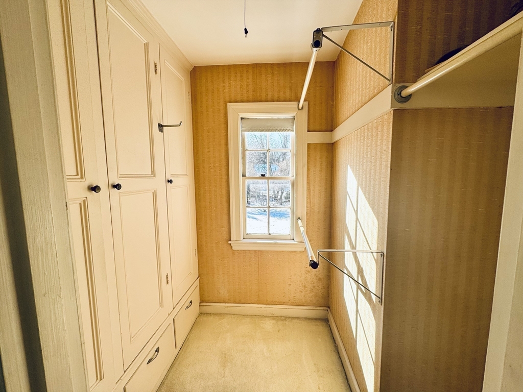 45 Beverly Road Brookline, MA 02467 - Photo 28 of 42 a view of a bathroom with a window and brick walls