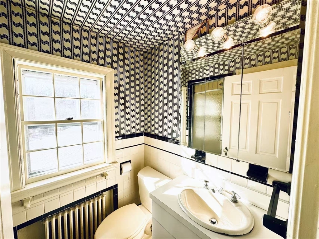 45 Beverly Road Brookline, MA 02467 - Photo 29 of 42 a bathroom with a sink a toilet and tub