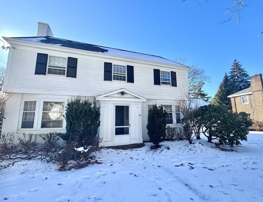 45 Beverly Road Brookline, MA 02467 - Photo 35 of 42 a front view of a house with garden