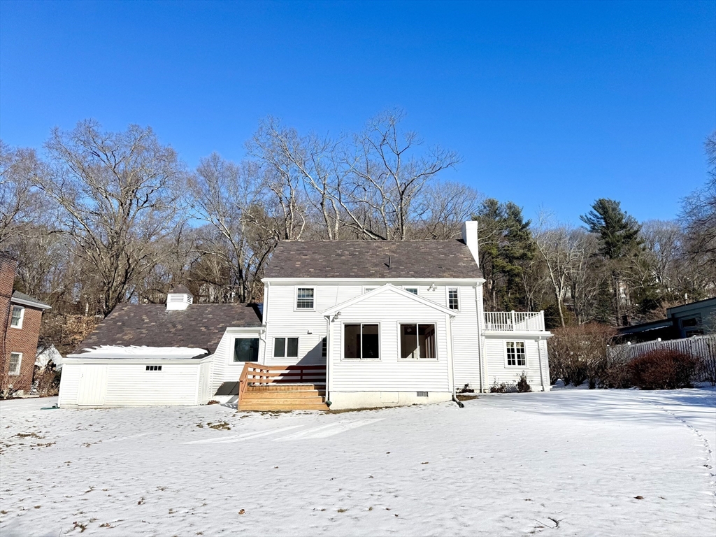 45 Beverly Road Brookline, MA 02467 - Photo 37 of 42 a view of a white house with a snow in the background