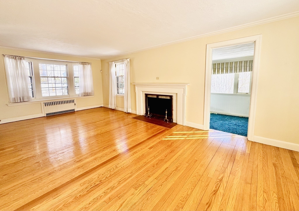 45 Beverly Road Brookline, MA 02467 - Photo 4 of 42 a view of an empty room with wooden floor and a window