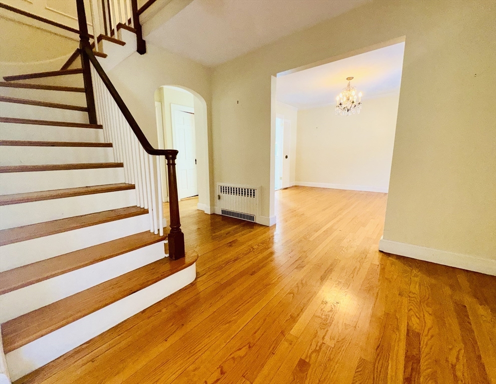 45 Beverly Road Brookline, MA 02467 - Photo 6 of 42 a view of an empty room with wooden floor and a window