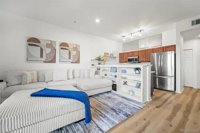 a bedroom with a bed and white cabinets