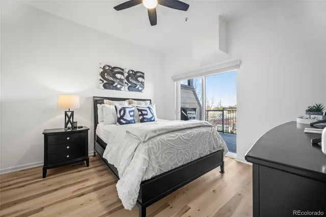 a bedroom with a bed and a desk