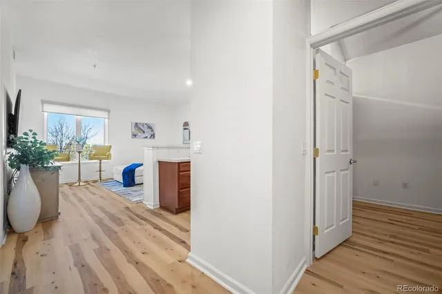 a room with wooden floor and furniture