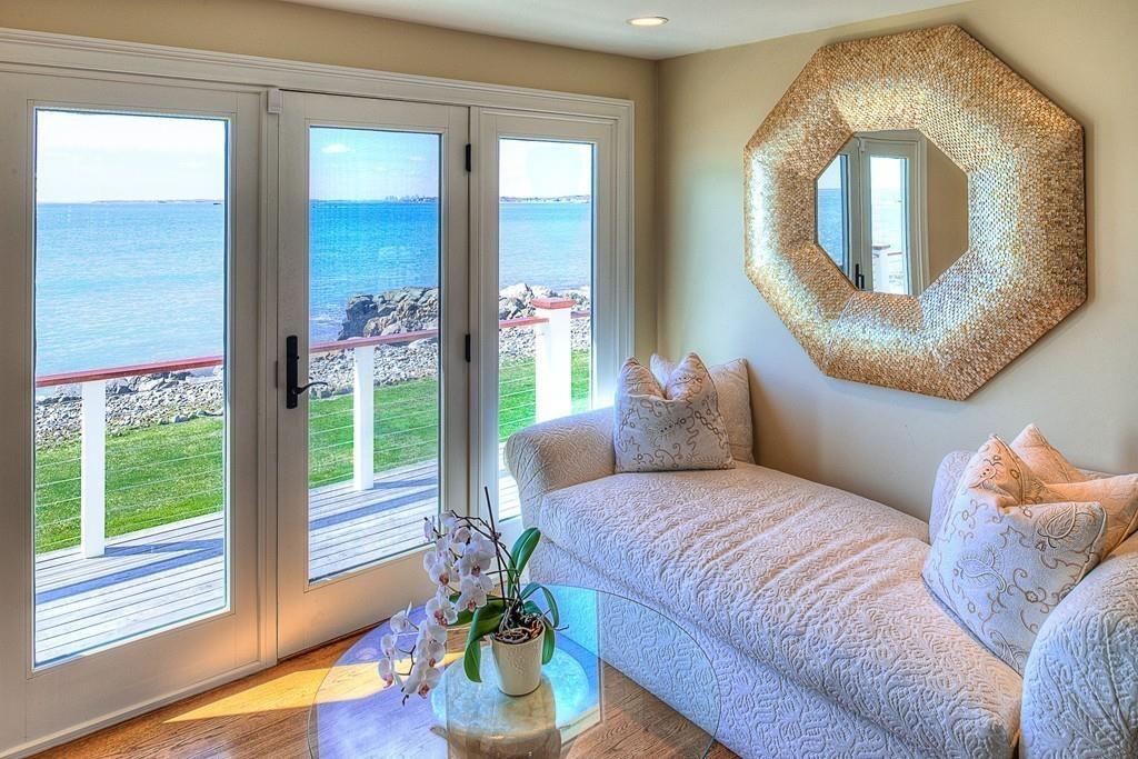 201 Ocean Avenue Marblehead, MA 01945 - Photo 11 of 21 a bedroom with a bed and a mirror